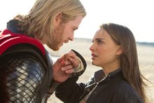 Thor holds Jane Foster's hand in the MCU Thor movie