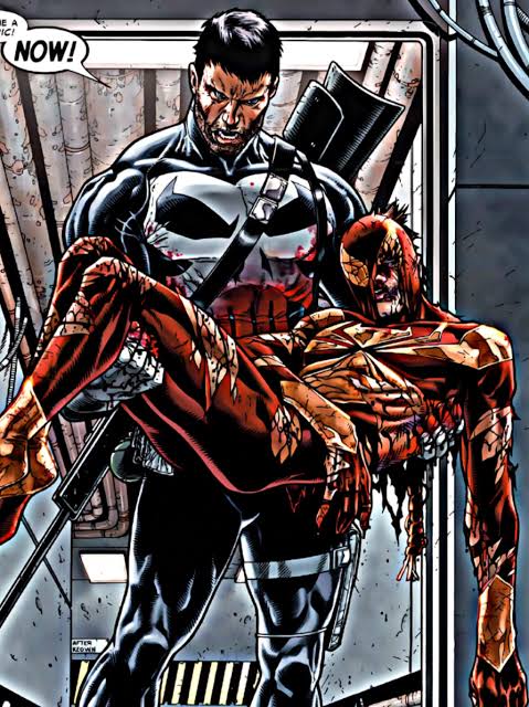 The Punisher carrying a badly injured Spider-Man to safety